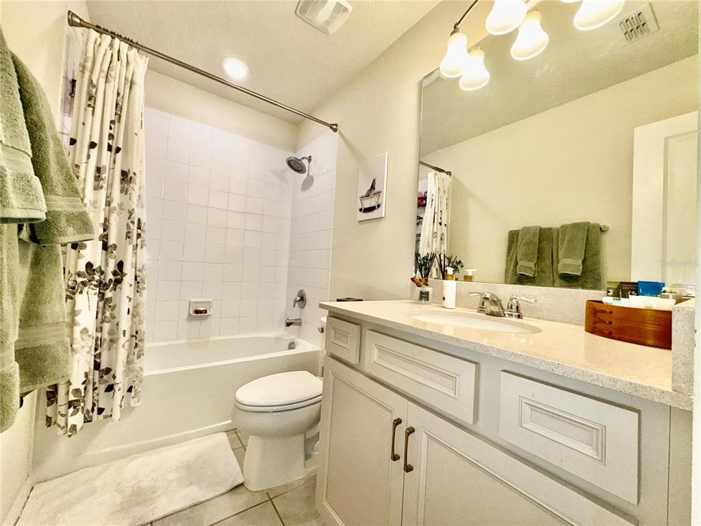 2208 Gopher Tortoise Terrace Oakland, FL 34787 - Photo 34 of 50 a bathroom with a sink a toilet and shower