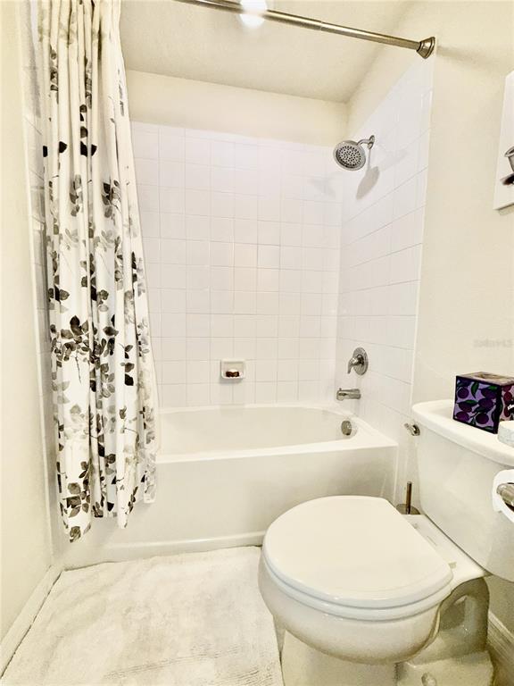 2208 Gopher Tortoise Terrace Oakland, FL 34787 - Photo 35 of 50 a bathroom with a toilet and a shower