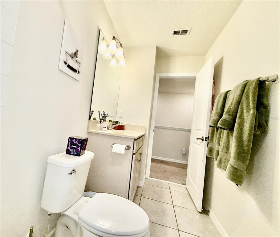 2208 Gopher Tortoise Terrace Oakland, FL 34787 - Photo 36 of 50 a bathroom with a sink a toilet and shower