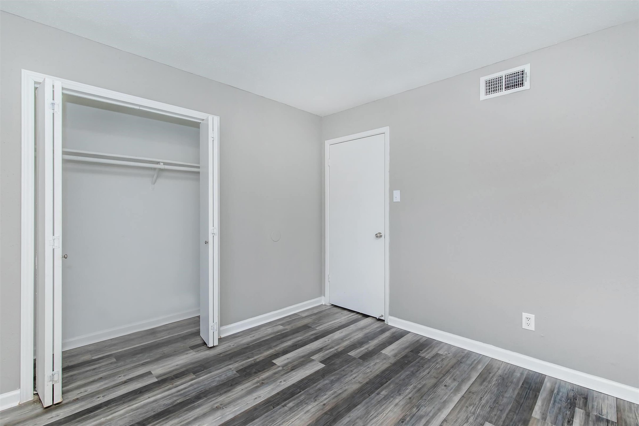 18001 Cypress Trace Road, Unit 1301 Houston, TX 77090 - Photo 19 of 34 a view of a room with wooden floor and closet