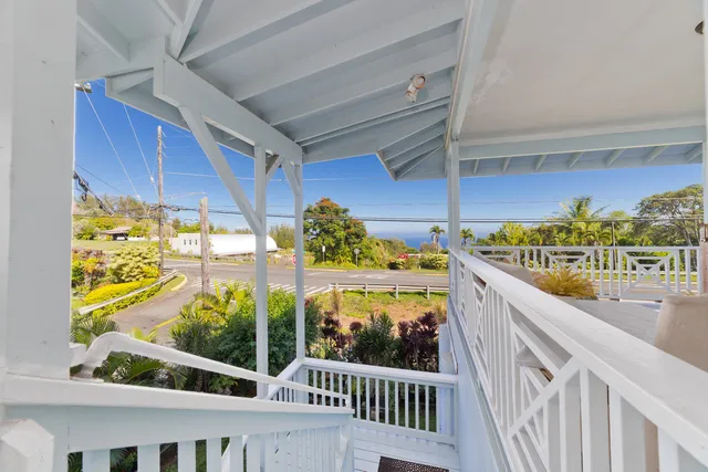 a view of a livingroom with wooden floor and a window
