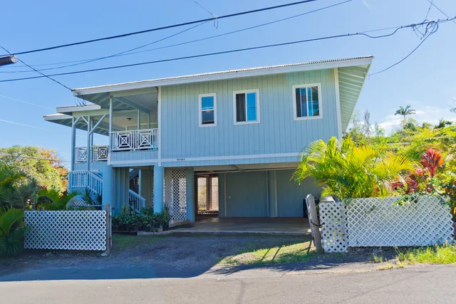 a view of a house with a flower in a garden