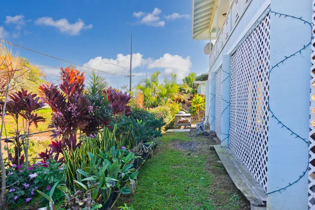 an aerial view of residential houses with outdoor space and swimming pool