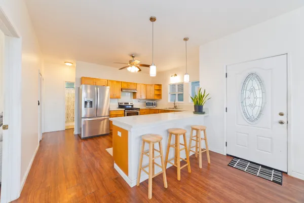 a view of a kitchen and dining room