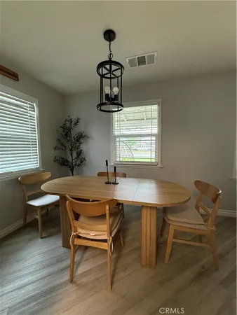 a dining room with a table and chairs