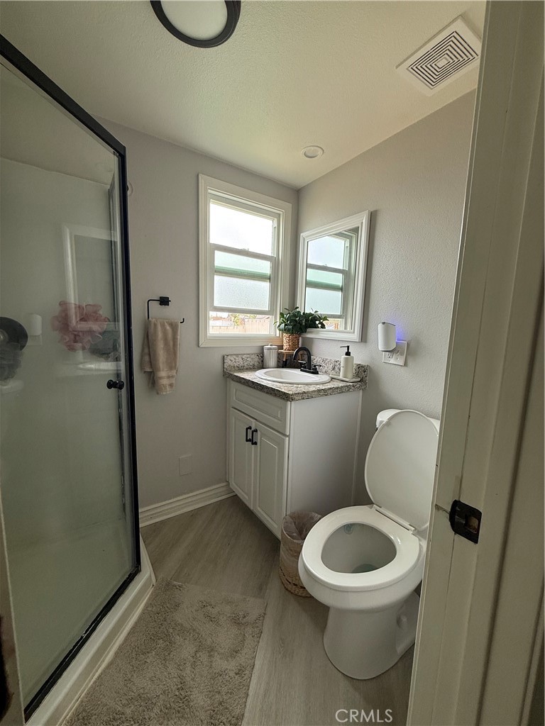 1025 Davids Road Perris, CA 92571 - Photo 9 of 13 a bathroom with a toilet a sink and a window