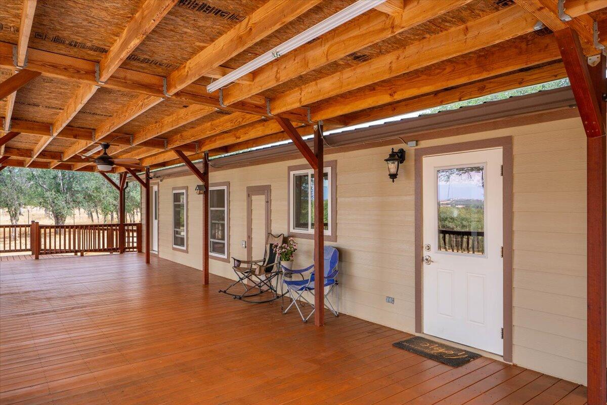 12560 Moon Shadow Ranch Road Red Bluff, CA 96080 - Photo 8 of 67 a view of a room with wooden floor and furniture