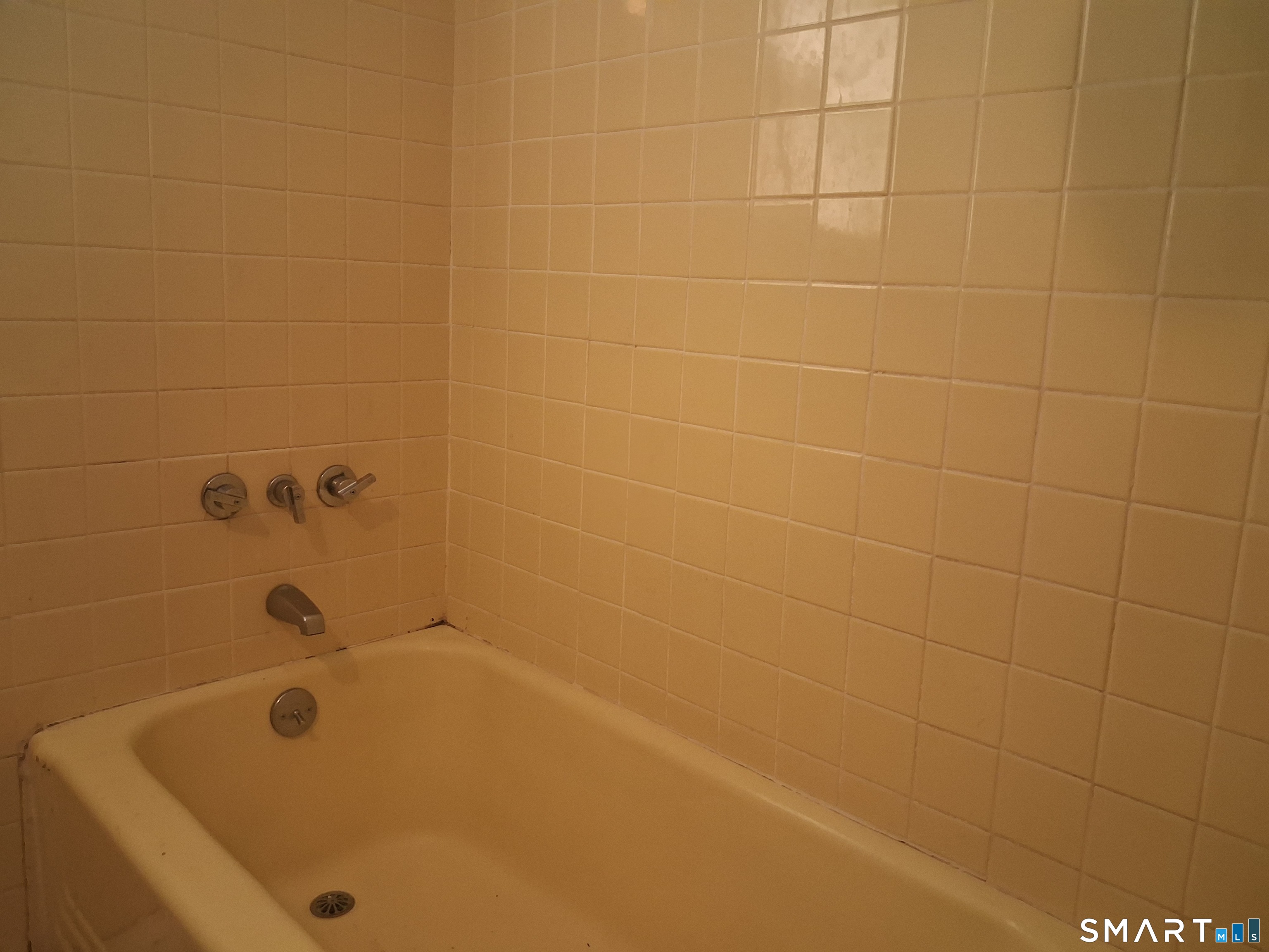26 4th Street Hamden, CT 06514 - Photo 36 of 40 a bathroom with a bathtub