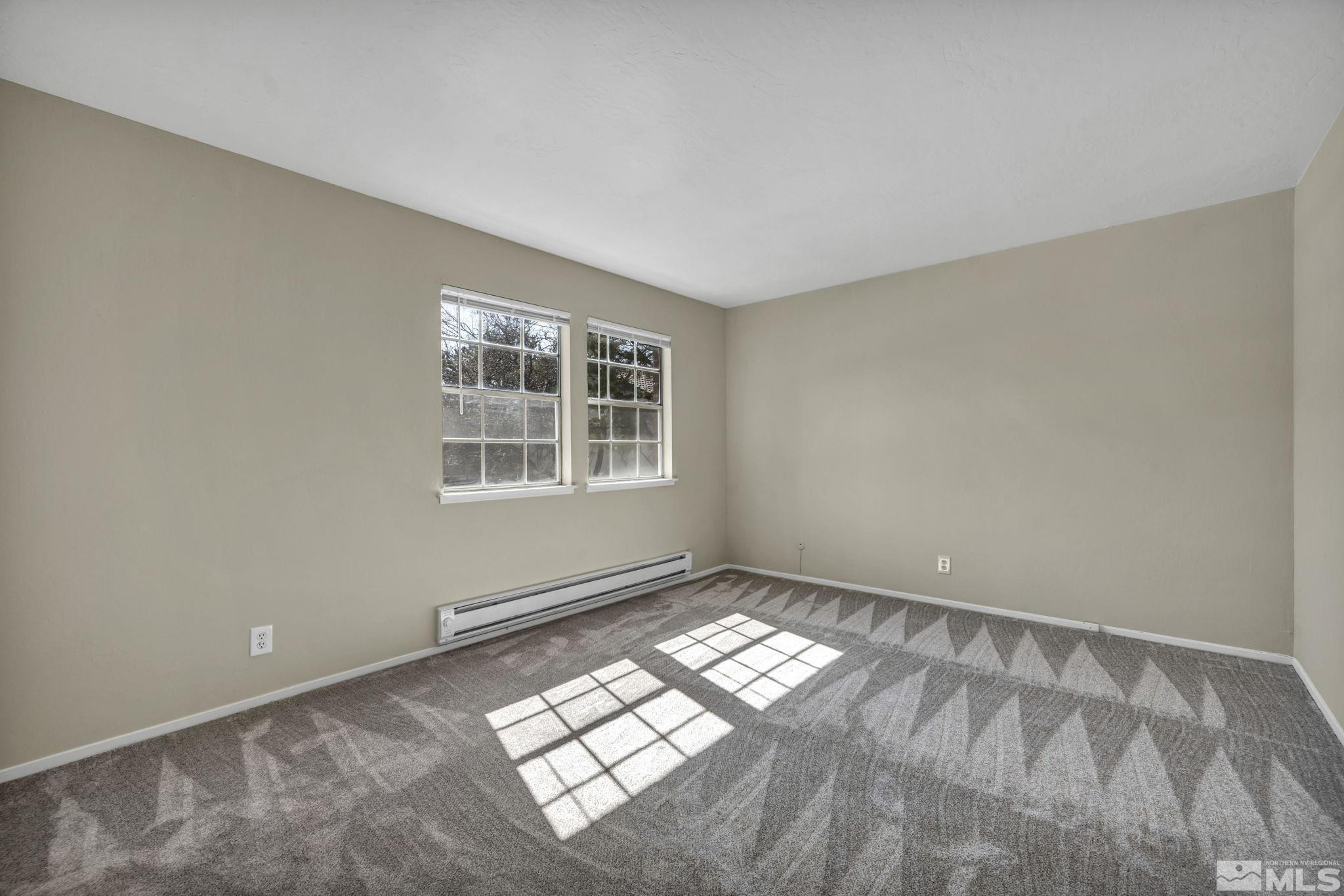 435 Pine Meadows Drive, Unit 33 Sparks, NV 89431 - Photo 13 of 17 a view of an empty room with a window