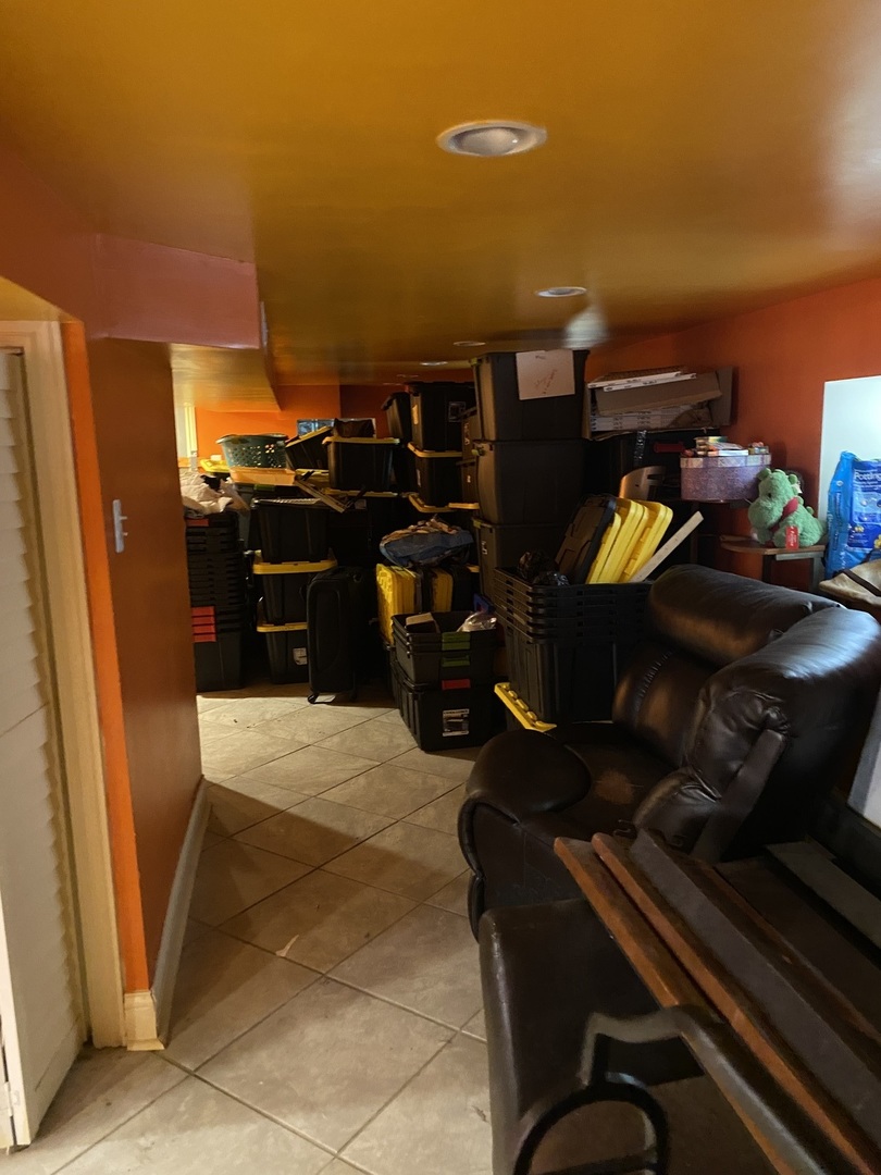 8611 South Aberdeen Street Chicago, IL 60620 - Photo 11 of 12 a picture of water heater room with furniture