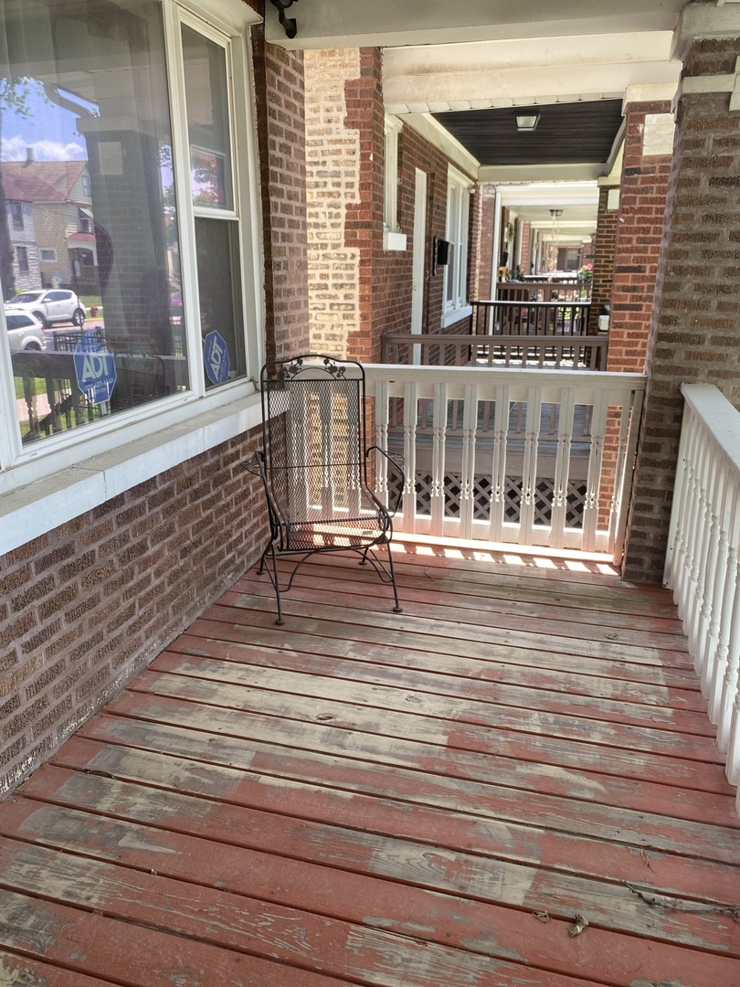 8611 South Aberdeen Street Chicago, IL 60620 - Photo 2 of 12 a view of a building with a balcony