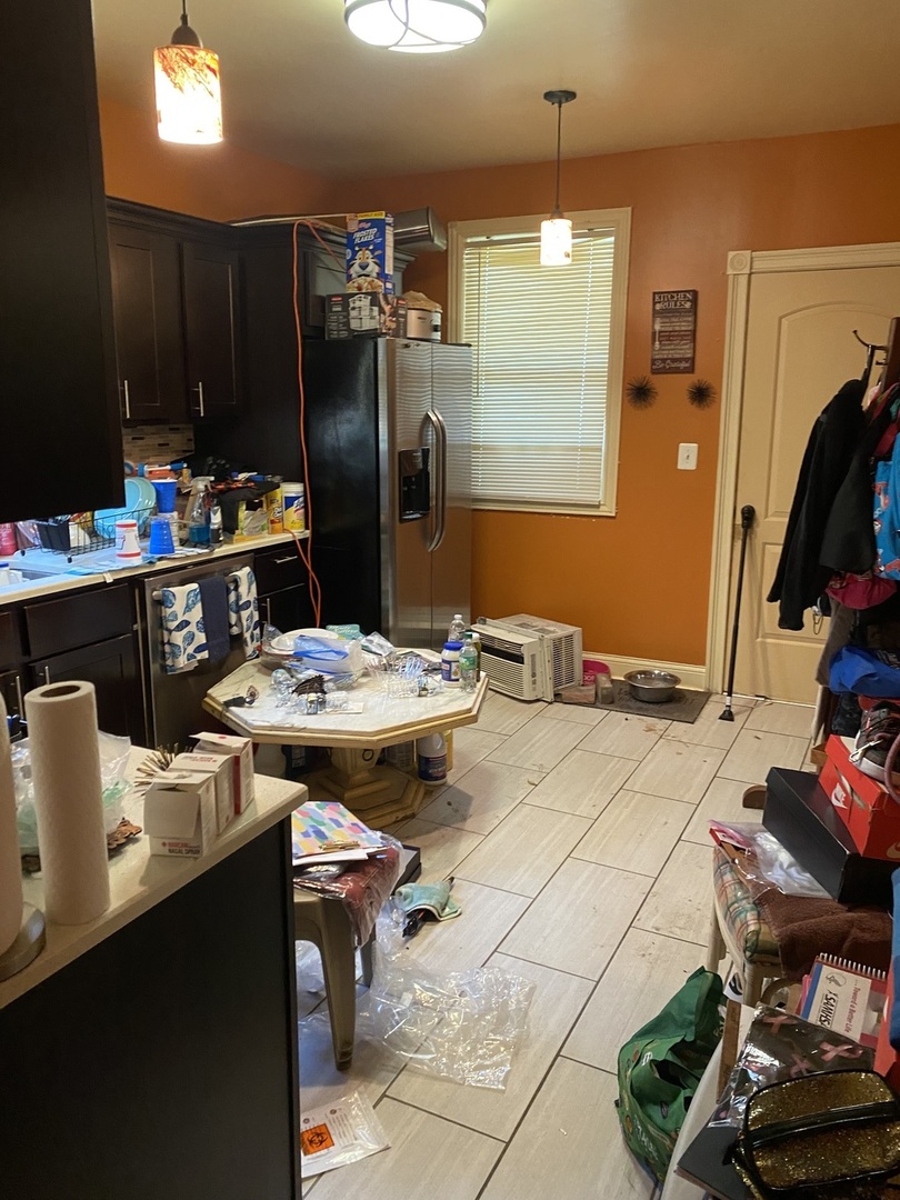 8611 South Aberdeen Street Chicago, IL 60620 - Photo 5 of 12 a kitchen with a sink appliances and cabinets