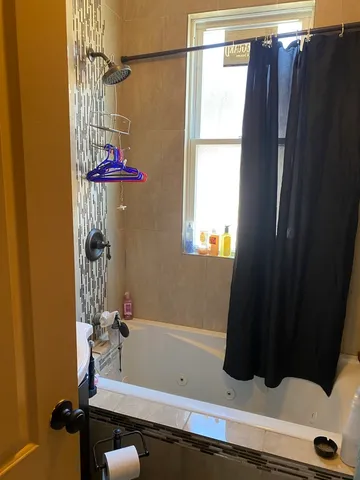 a view of a patio with table and chairs and potted plants