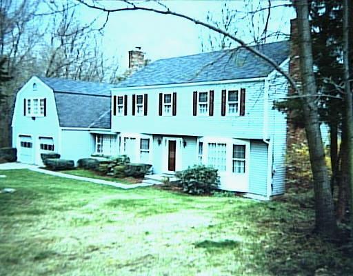 90 Pipers Hill Road Wilton, CT 06897 - Photo 1 of 1 a front view of a house with a garden