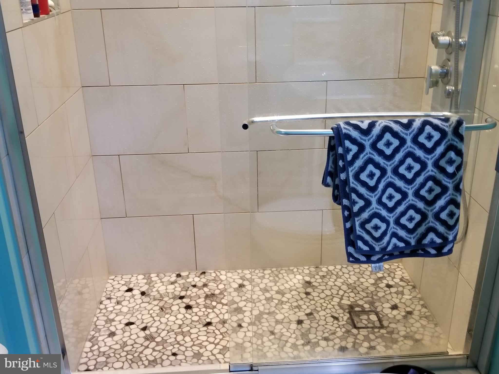 6218 Apache Street Springfield, VA 22150 - Photo 14 of 30 a bathroom with a shower
