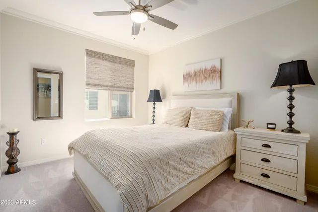 a bathroom with a sink a toilet and a large mirror