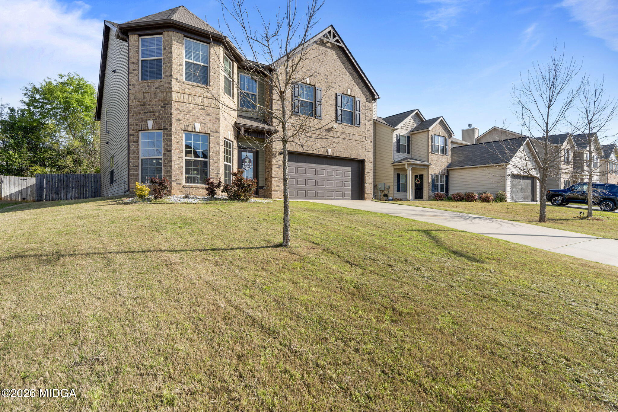 184 Amelia Drive, Unit 162 Byron, GA 31008 - Photo 2 of 46 a view of a white house with a yard