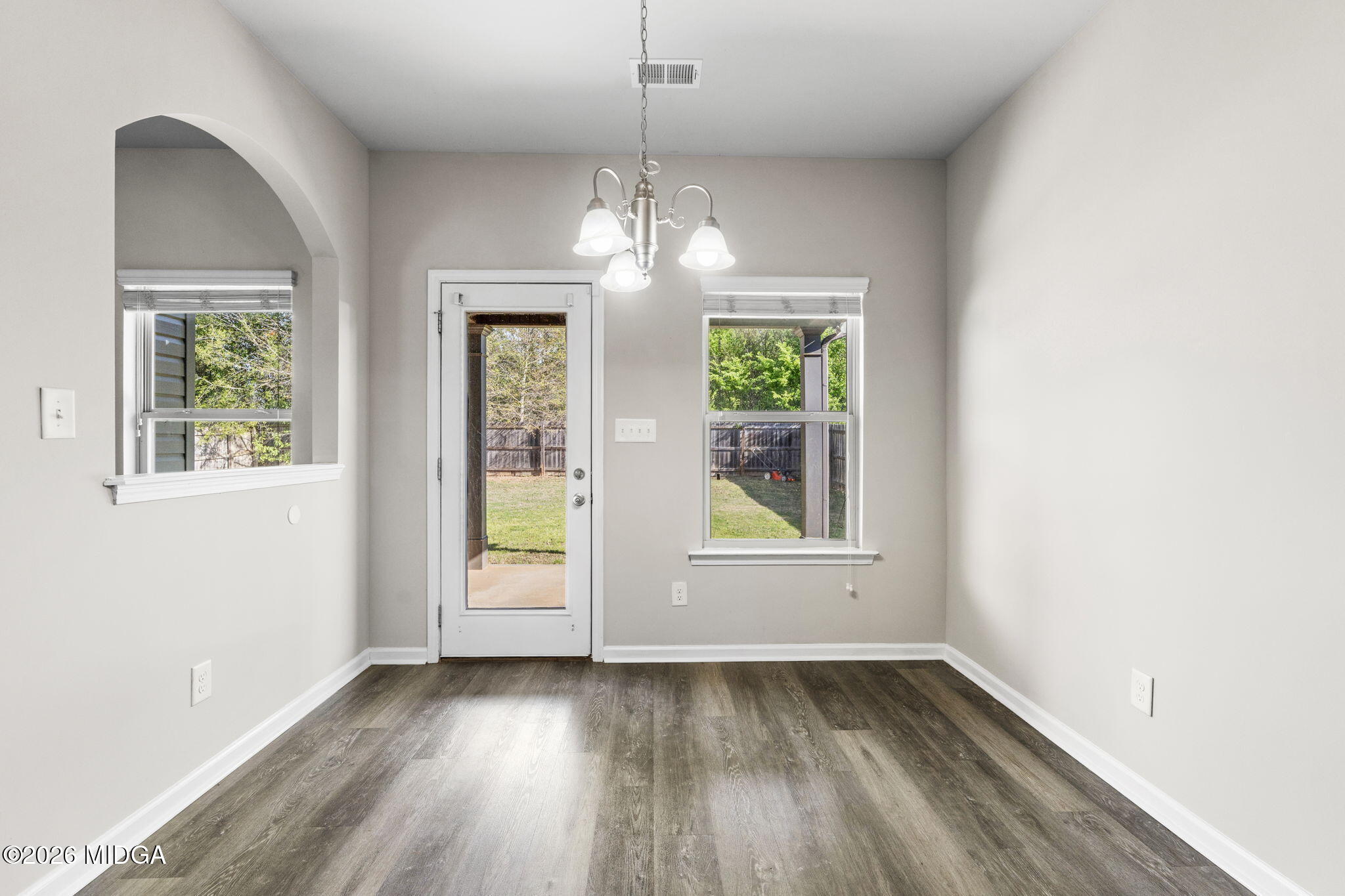 184 Amelia Drive, Unit 162 Byron, GA 31008 - Photo 23 of 46 wooden floor in an empty room with a window