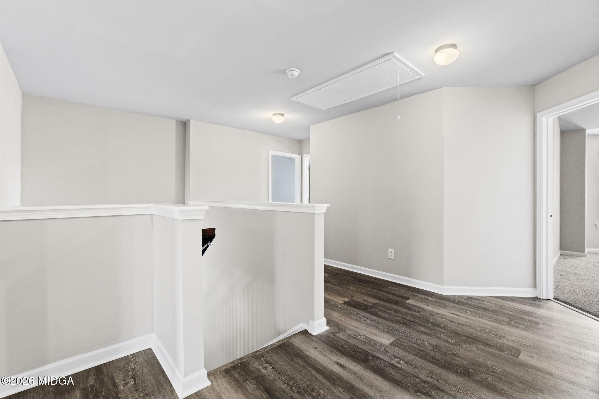 184 Amelia Drive, Unit 162 Byron, GA 31008 - Photo 24 of 46 a view of a hallway with wooden floor