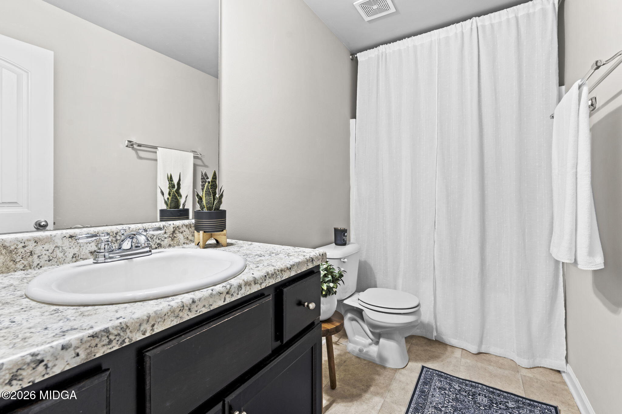 184 Amelia Drive, Unit 162 Byron, GA 31008 - Photo 28 of 46 a bathroom with a granite countertop sink and a mirror