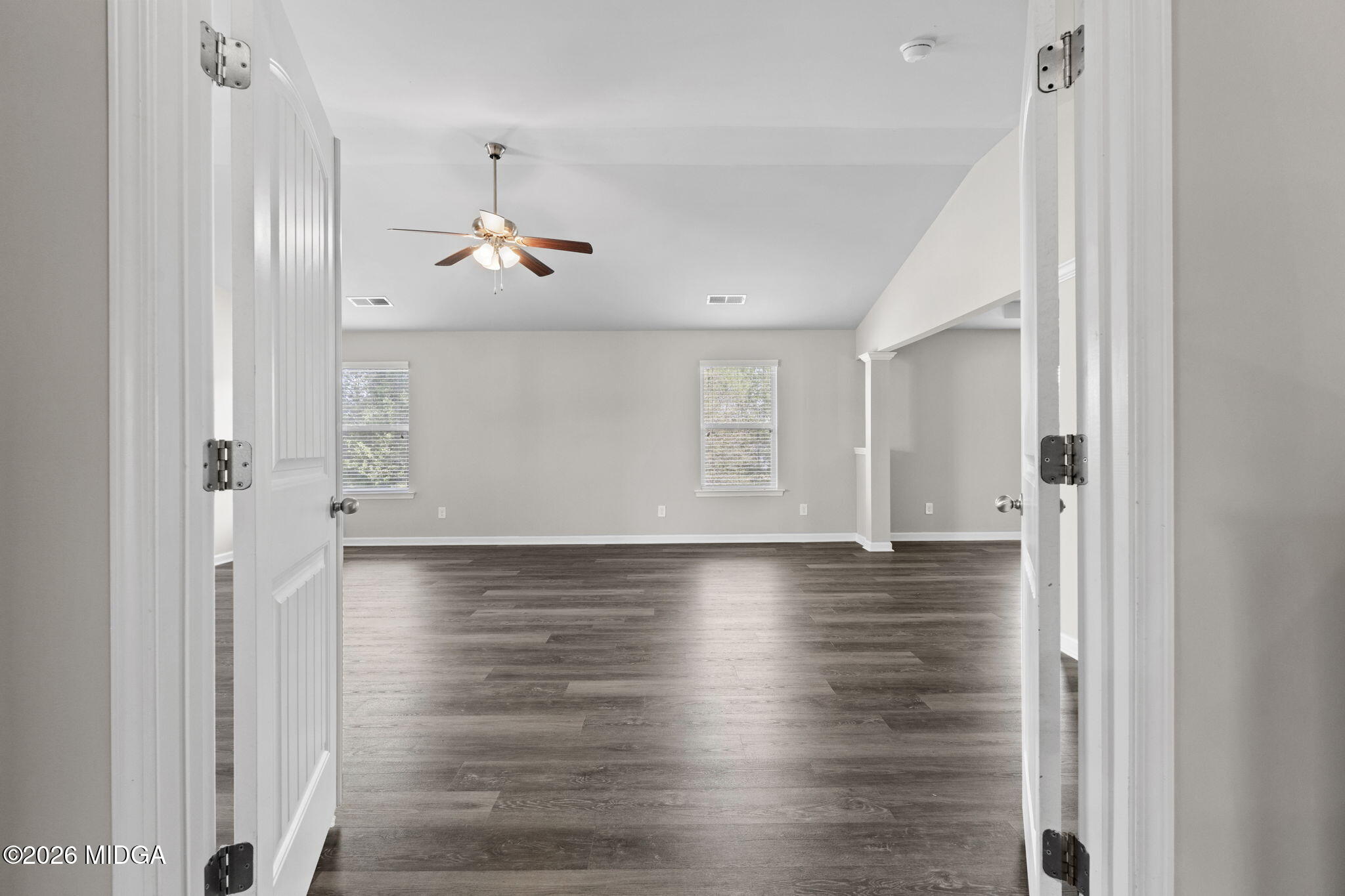 184 Amelia Drive, Unit 162 Byron, GA 31008 - Photo 30 of 46 a view of a kitchen with a hardwood floor and a ceiling fan