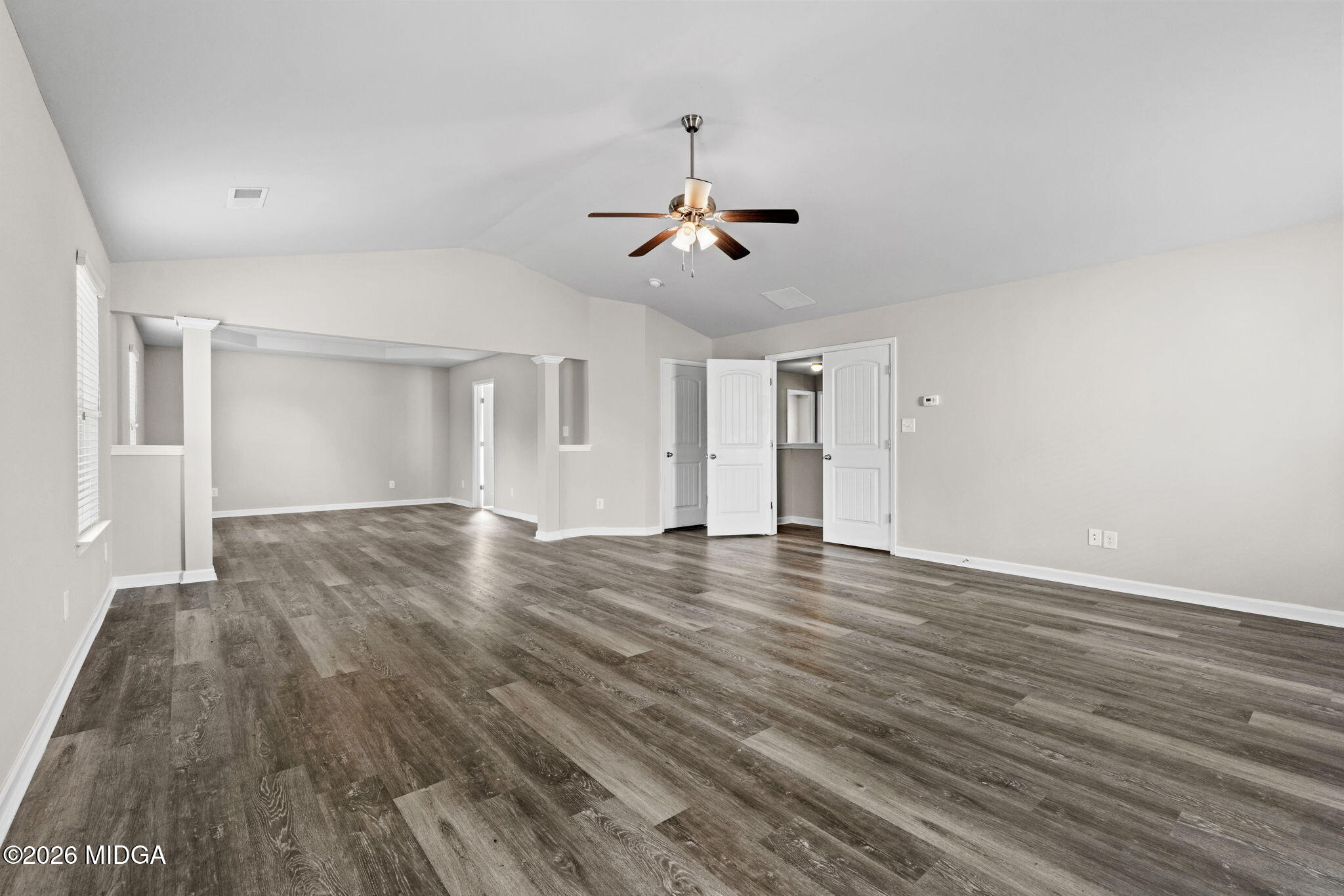 184 Amelia Drive, Unit 162 Byron, GA 31008 - Photo 32 of 46 a view of a room with wooden floor and ceiling fan