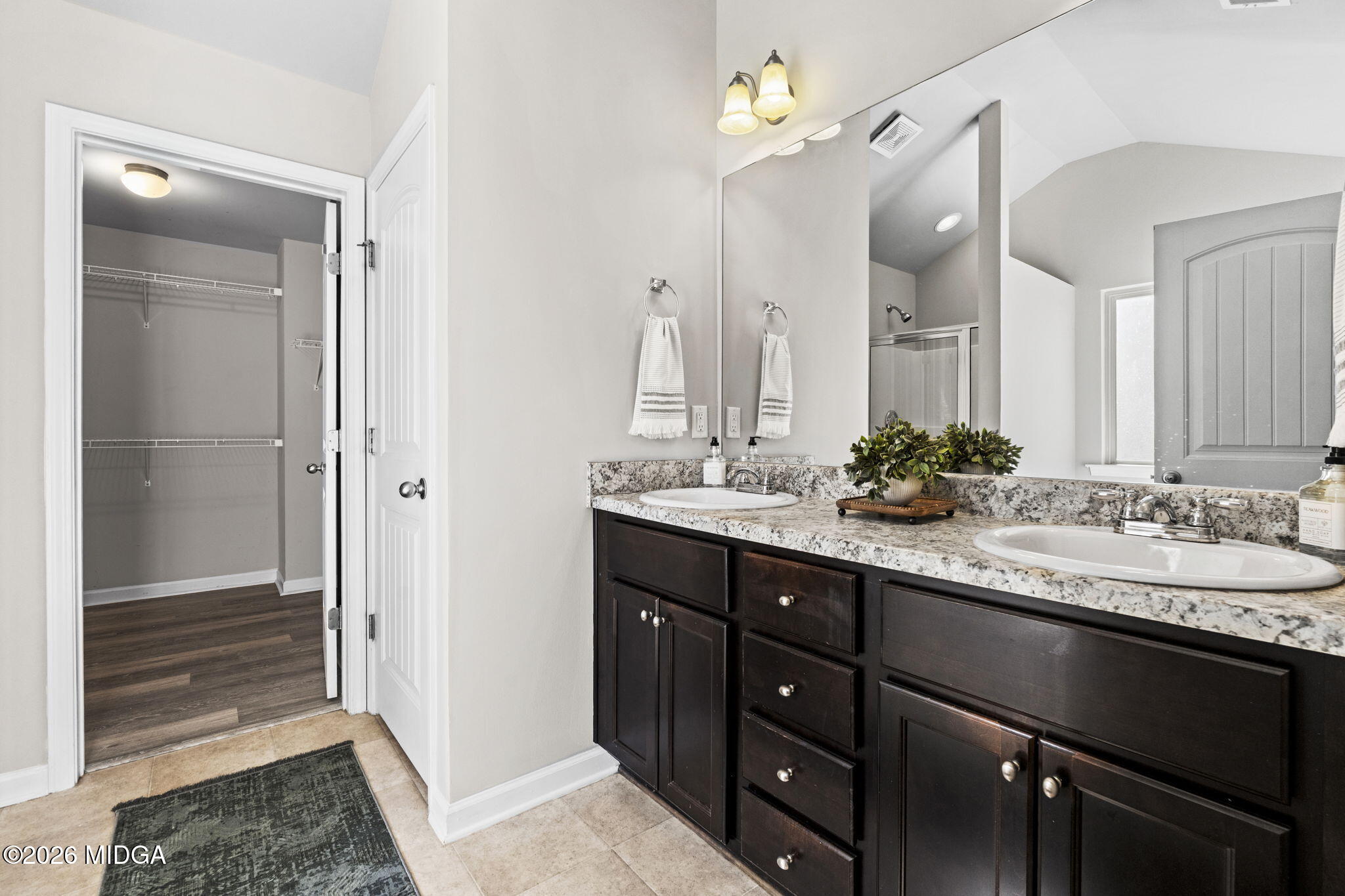 184 Amelia Drive, Unit 162 Byron, GA 31008 - Photo 37 of 46 a bathroom with a granite countertop sink a mirror and a shower