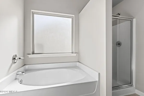 a white bath tub sitting in a bathroom