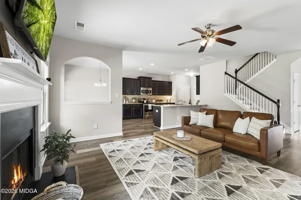 a living room with furniture and a flat screen tv