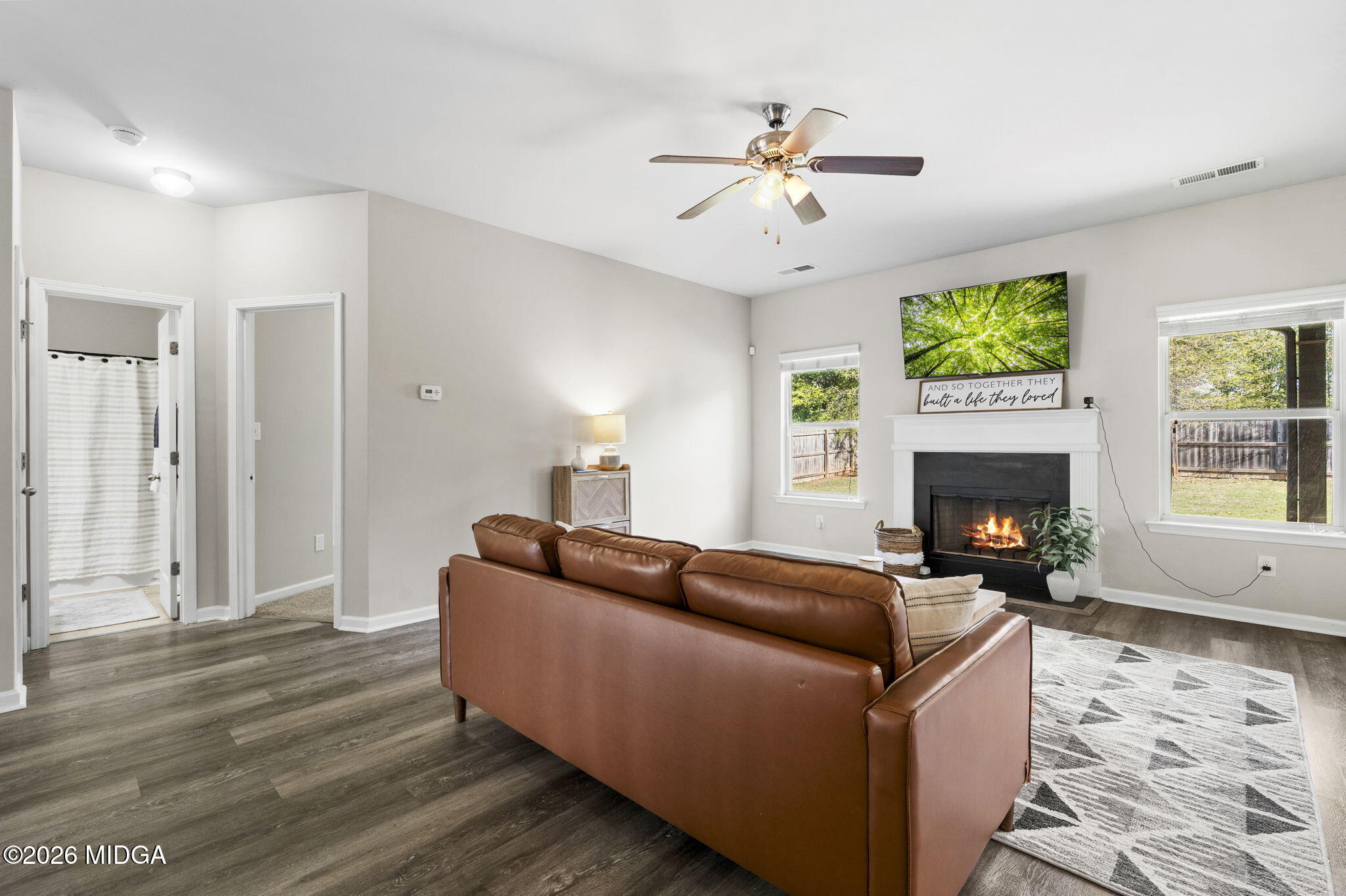 184 Amelia Drive, Unit 162 Byron, GA 31008 - Photo 6 of 46 a living room with furniture and a fireplace