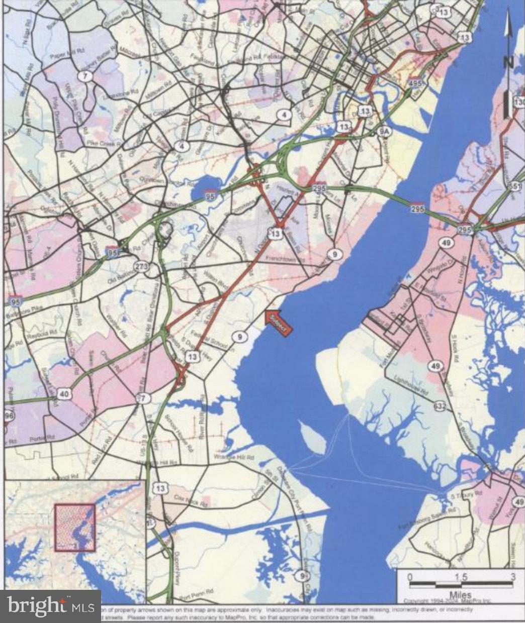 a view of a tree in a yard and a chair