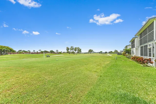 a view of a building and yard