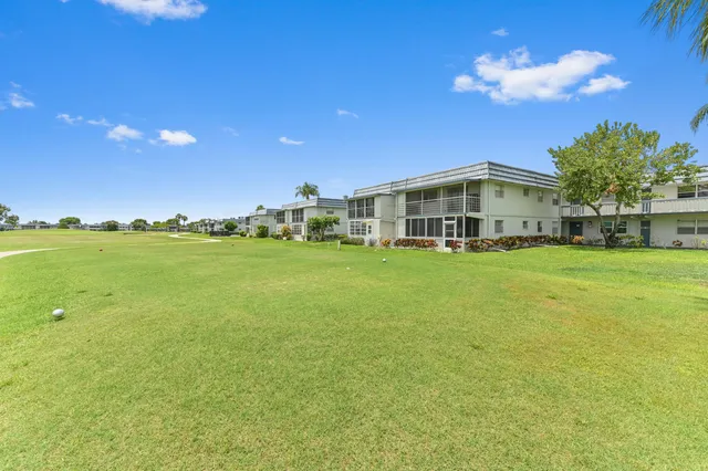 a view of a house with a big yard
