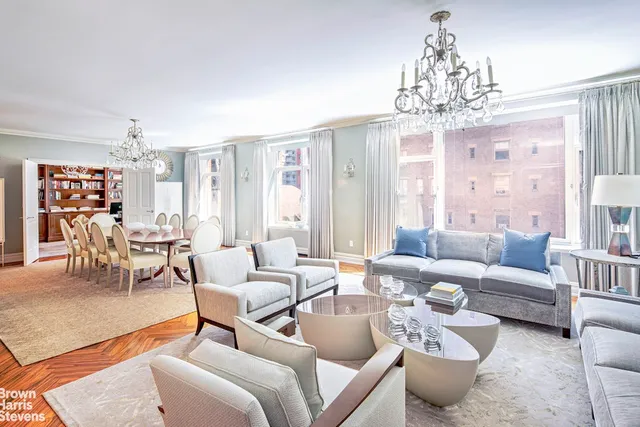 a picture of a room with lots of white furniture