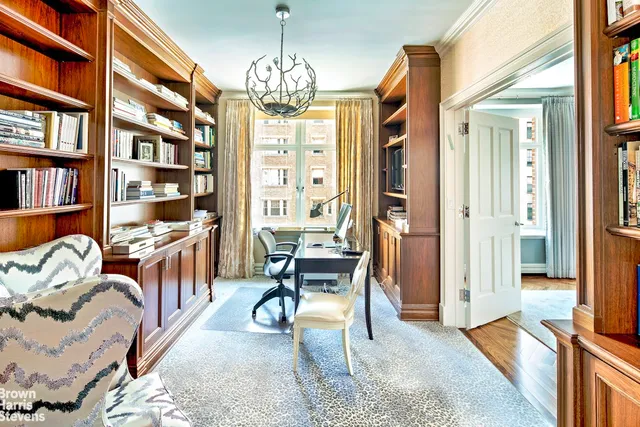 a view of a dining room with furniture and window