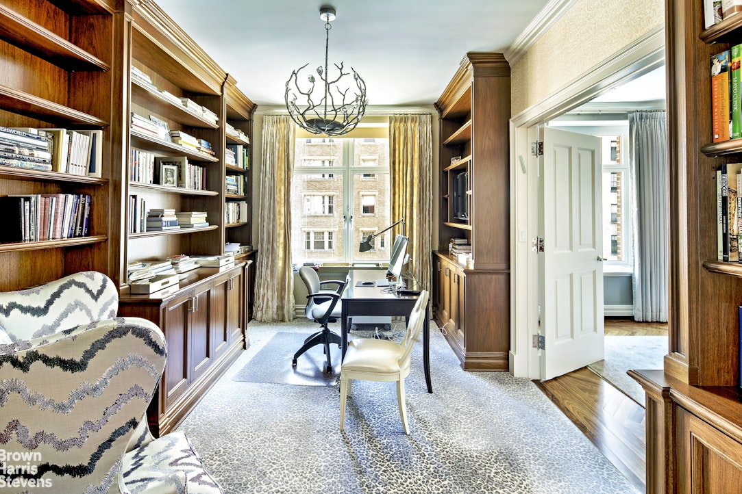 535 West End Avenue, Unit 8B Manhattan, NY 10024 - Photo 5 of 16 a bedroom with furniture and a chandelier