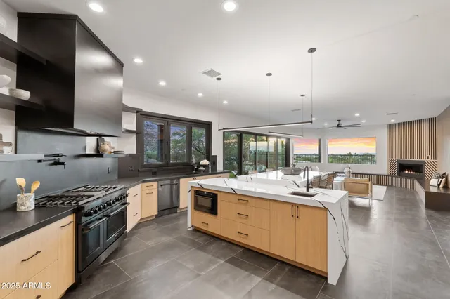 a large kitchen with stainless steel appliances lots of counter space