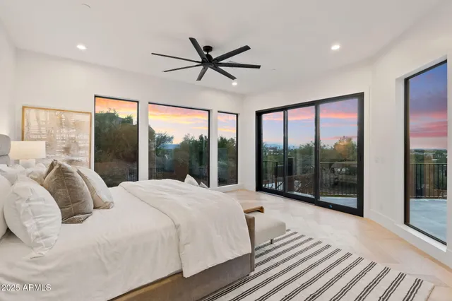 a dining room with a large window and table