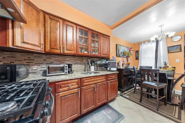 a kitchen with granite countertop lots of counter top space and stainless steel appliances