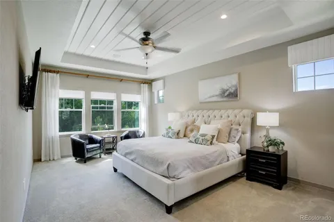 a bedroom with a bed and a couch