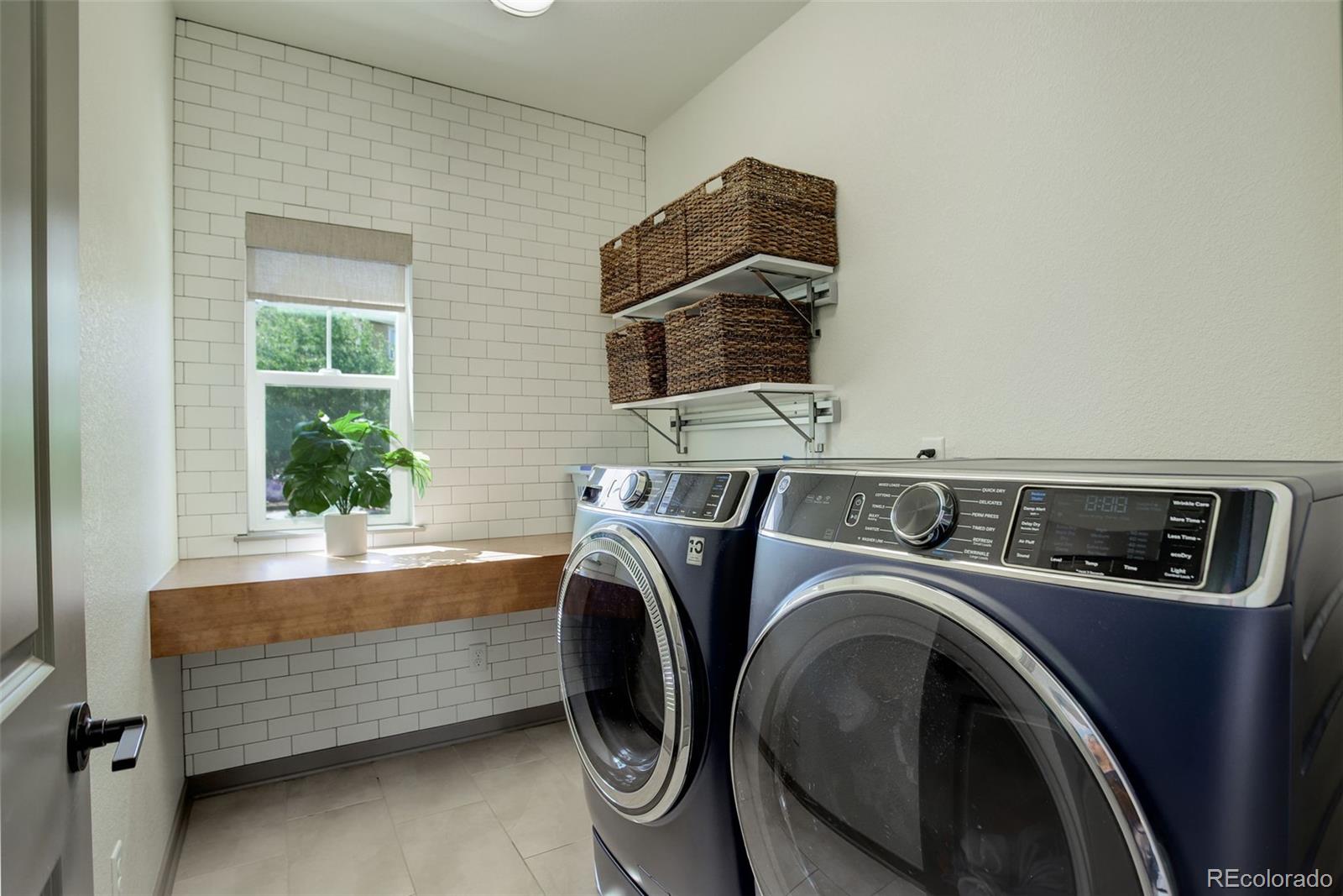 23451 East Rockinghorse Parkway Aurora, CO 80016 - Photo 23 of 36 a utility room with dryer and washer