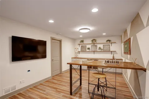 a view of a livingroom with furniture and a flat screen tv