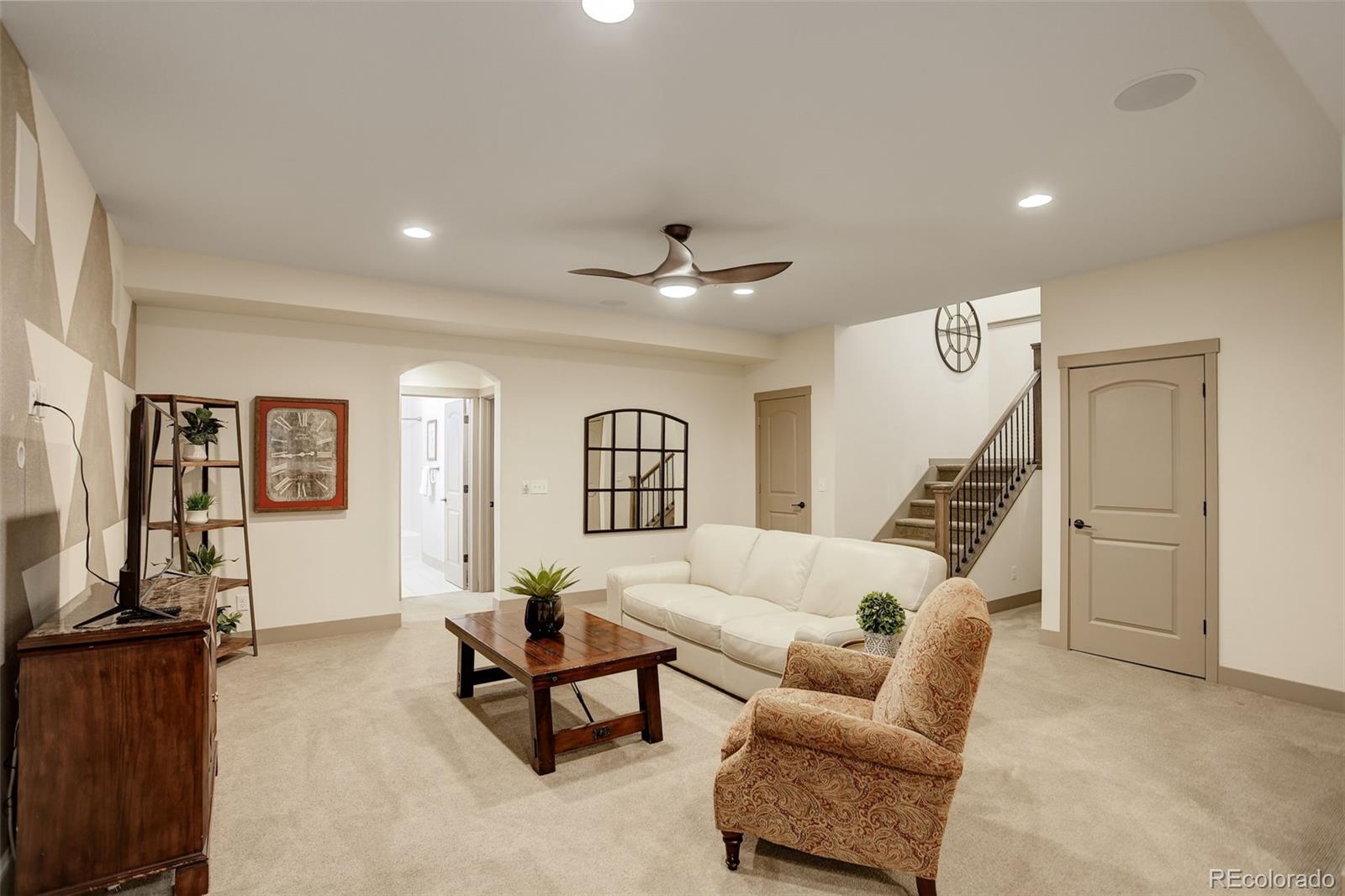23451 East Rockinghorse Parkway Aurora, CO 80016 - Photo 29 of 36 a living room with furniture and a window