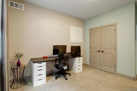 a view of a workspace with furniture