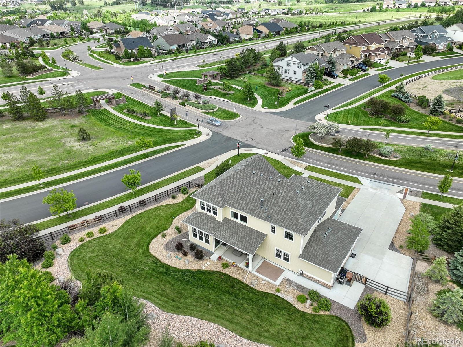 23451 East Rockinghorse Parkway Aurora, CO 80016 - Photo 33 of 36 an aerial view of a house with a garden and lake view