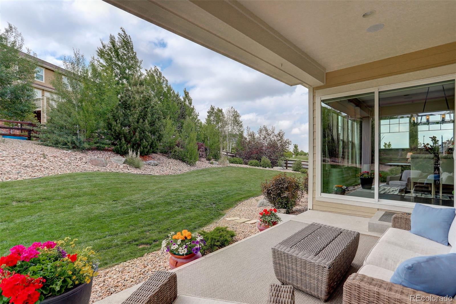 23451 East Rockinghorse Parkway Aurora, CO 80016 - Photo 35 of 36 a view of a garden with patio
