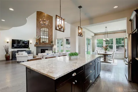a kitchen with sink cabinets and wooden floor
