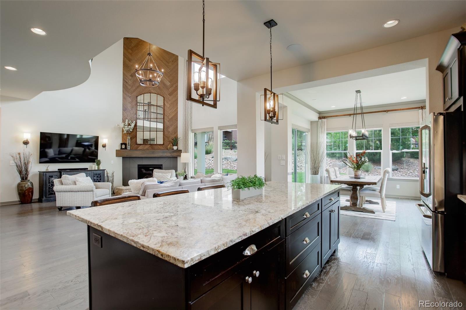 23451 East Rockinghorse Parkway Aurora, CO 80016 - Photo 6 of 36 a kitchen with sink cabinets and wooden floor