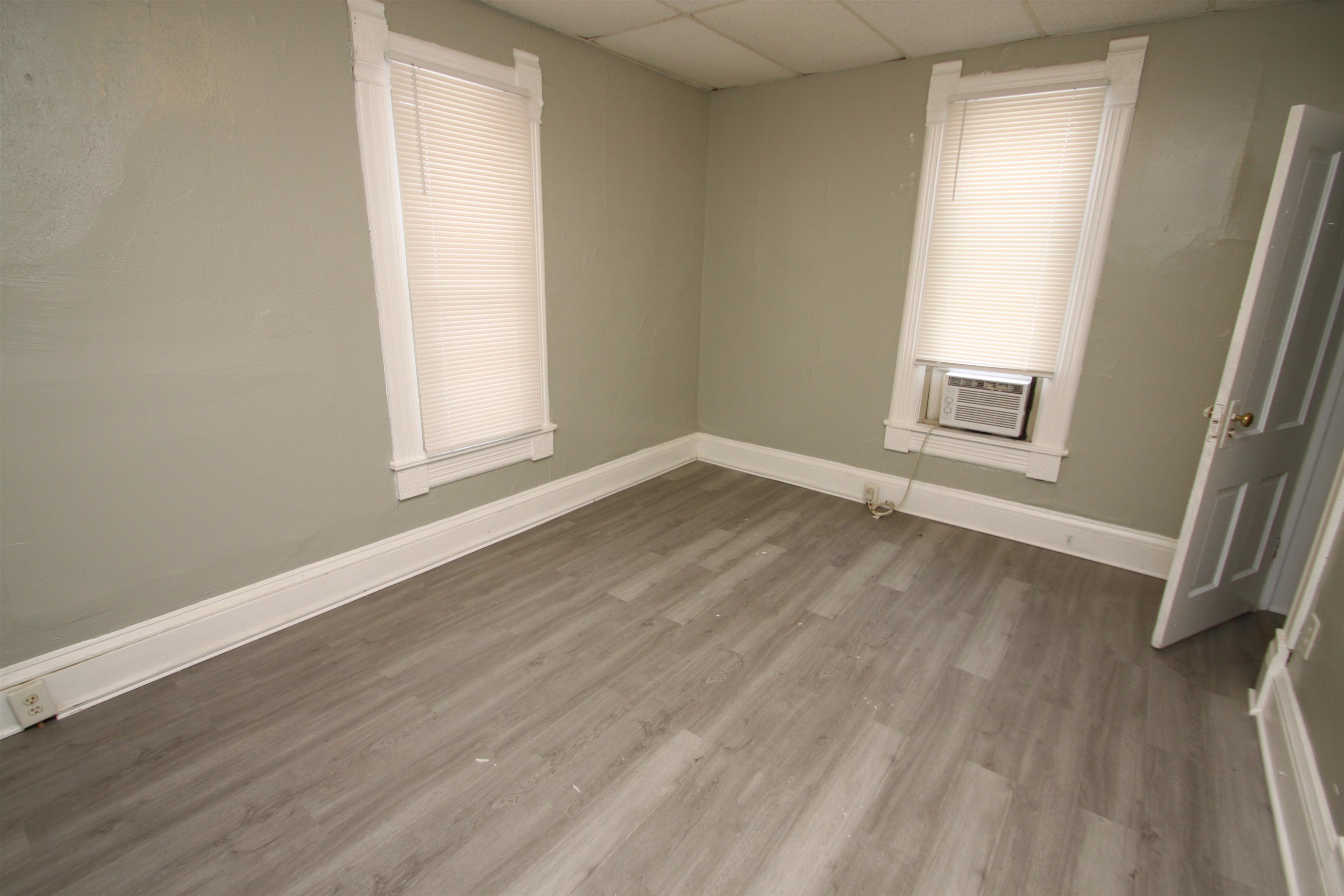 328 South Prospect Street Rockford, IL 61104 - Photo 11 of 14 an empty room with wooden floor and windows