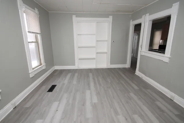 a kitchen with a stove sink and cabinets